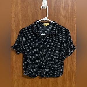 Cute, buttoned-up, polka dot blouse.